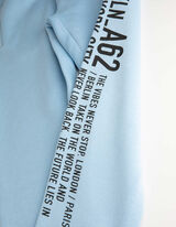 Bėgiojimo kelnės - Užra&scaron;as - sviesiai melynas