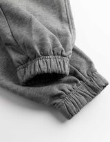 Joggingov&eacute; kalhoty - Třpytiv&yacute; potisk - seda