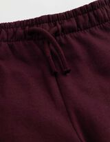 Joggingov&eacute; kalhoty - V&yacute;&scaron;ivka - Tmavě červen&aacute;