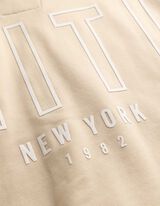 Cipz&aacute;ros meleg&iacute;tőfelső - H&aacute;tul nyomtatott minta - B&eacute;zs