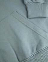 Kapucnis felső - H&aacute;tul nyomtatott minta - vilagos zold